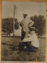 Two men in a grassy field, circa 1904