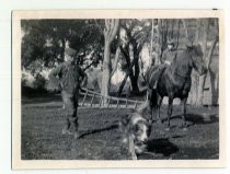 Wong Sing and girl on horseback