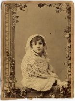 Portrait of young woman in lace shawl