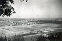 Blossom Hill Road view of field and housing subdivisions