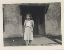 Ruby Levin standing in front of concrete building