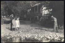 Young children standing at water's edge, Carmon Ranch, circa 1918