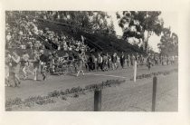 Procession of male students in costume at Stanford University track