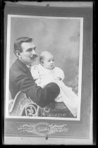 Portrait of man with mustache and infant