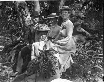 Group portrait under the trees, c. 1912