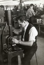 Man working on radio assembly in Motorola factory