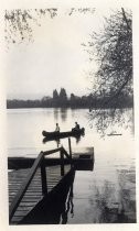 Two men in canoe on lake