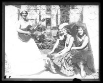 Four women dressed in flamenco dresses for Fiesta de las Rosas