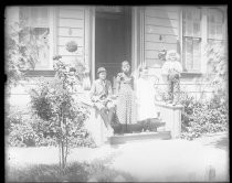 Four children on steps of house