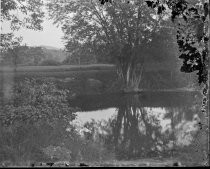 Landscape with pond, trees and hills, c. 1912