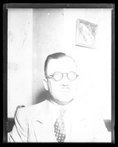 Man in three-piece suit with polka-dot tie