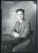 Portrait of young man at desk, c. 1928