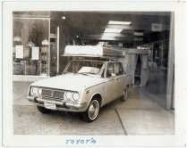 Travelite Portable Camper on top of Toyota Corona