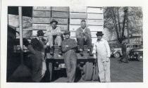 Joe Lewis with Sunsweet Packing workmen on back of truck