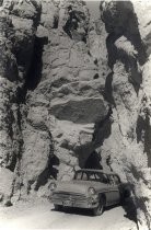 Buick automobile under rock cliffs