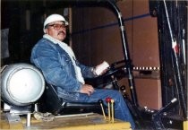 Ricardo Gutierrez driving forklift in the warehouse at Del Monte Plant #3