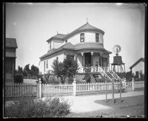 Victorian three-story residence, with windmill