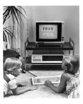 Children using piano program on home computer