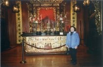 Margaret Kee Marr standing in front of altar at Ng Shing Gung