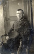 German soldier in uniform sitting in chair