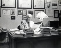de Forest at his desk, facing right
