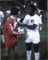 Johnny Moore and Pele before game, 1976