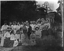 Family portrait in front of tankhouse, c. 1912