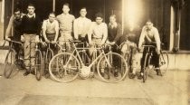 Group portrait of young men and their bicycles