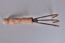 Iron and wood hand cultivator