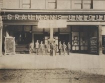 Men in front of Grauman's Unique Theater