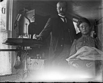 Woman seated in dentist's office, c. 1912