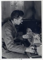 Portrait of Charles Litton at glass blowing machine