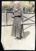 Young woman in school uniform, holding a book