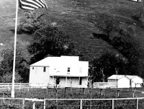 "Mount Hamilton livery building with flag - closeup"