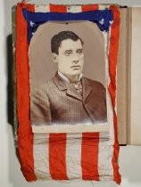 Portrait of man surrounded by flag cloth