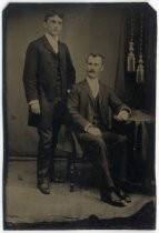 Portrait of two men, one seated