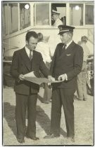 "Mike Antonacci and A. T. Sewell--co-pilot of blimp 'Volunteer'"