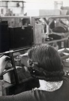 Woman working on radio assembly, Motorola