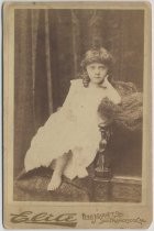 Portrait of unidentified child in bare feet