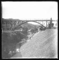 Railway bridge over ravine, with buildings