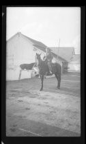 Al Kearney on horse near tables