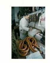 Leo Rossi Wraps a Torta for a Customer