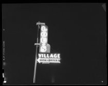 Lou's Village "Dine Dance" neon sign