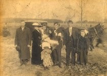 Group portrait with horse-drawn carriage