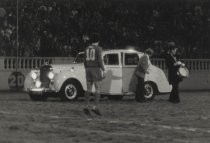 Car on field at Spartan Stadium with "Krazy" George Henderson