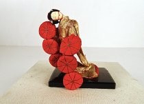 Japanese female doll figure twirling parasols