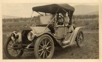 Woman behind wheel of automobile