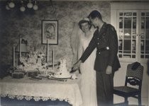 U.S. Army soldier and his bride cutting wedding cake