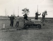 Crew with tractor and wire