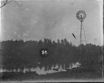 Windmill next to water, c. 1912